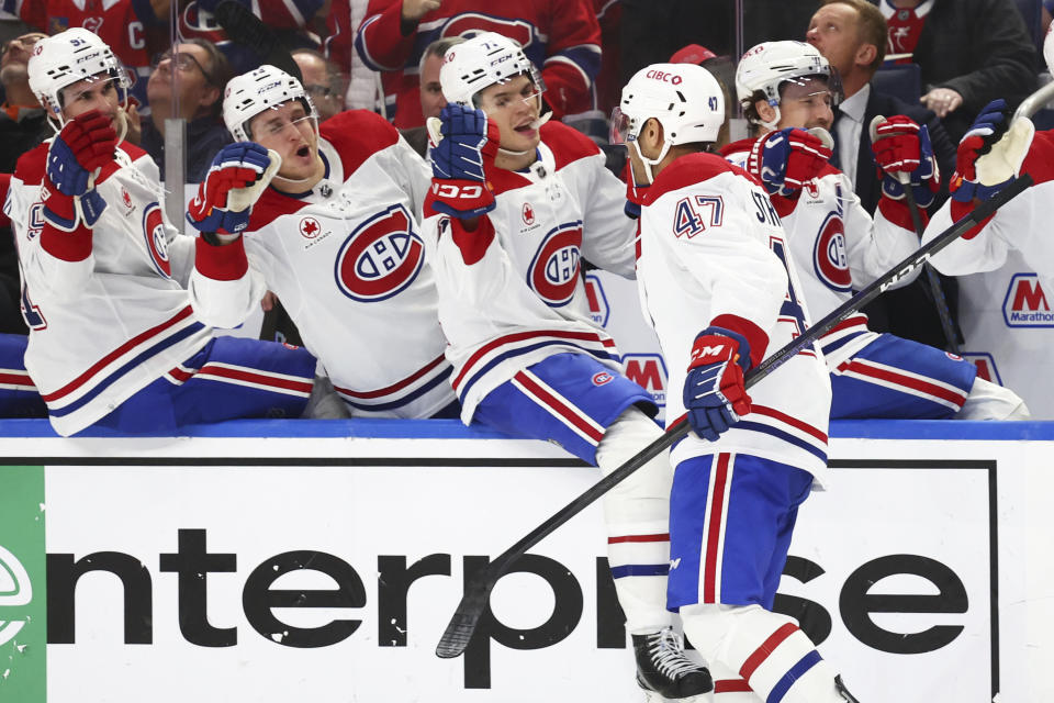 Montreal Canadiens defenseman Jayden Struble (47) is congratulated for his goal against the Buffalo Sabres during the second period of an NHL hockey game Saturday, Dec. 9, 2023, in Buffalo, N.Y. (AP Photo/Jeffrey T. Barnes)