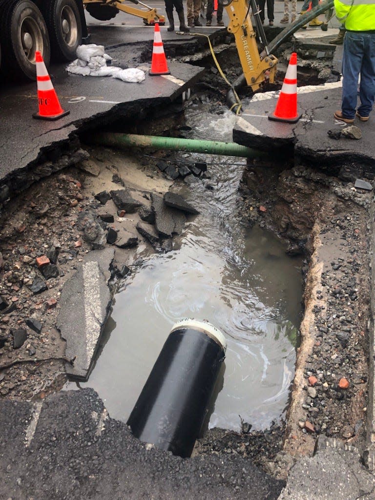 A broken water main is seen where contractors ruptured the line at a crucial junction near Observer Highway and Madison Street in Hoboken's southwest corner, causing a crisis across the mile-square city that continues more than a day later.