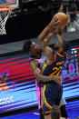 Golden State Warriors forward Andrew Wiggins (22) drives to the basket as Miami Heat forward Jimmy Butler (22) defends during the second half of an NBA basketball game, Thursday, April 1, 2021, in Miami. (AP Photo/Marta Lavandier)