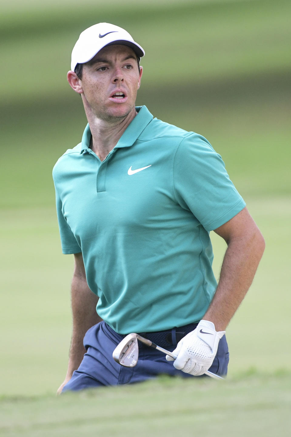 Rory McIlroy watches his shot to the fourth green during the final round of the Tour Championship golf tournament Sunday, Sept. 23, 2018, in Atlanta. (AP Photo/John Amis)