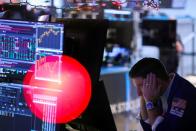 A trader works on the trading floor at the New York Stock Exchange (NYSE) in New York City