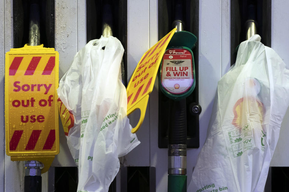 Closed pumps are seen on the forecourt of a petrol station which has run out of fuel after an outbreak of panic buying in the UK, in Manchester, England, Monday, Sept. 27, 2021. British Prime Minister Boris Johnson is said to be considering whether to call in the army to deliver fuel to petrol stations as pumps ran dry after days of panic buying. ( AP Photo/Jon Super)