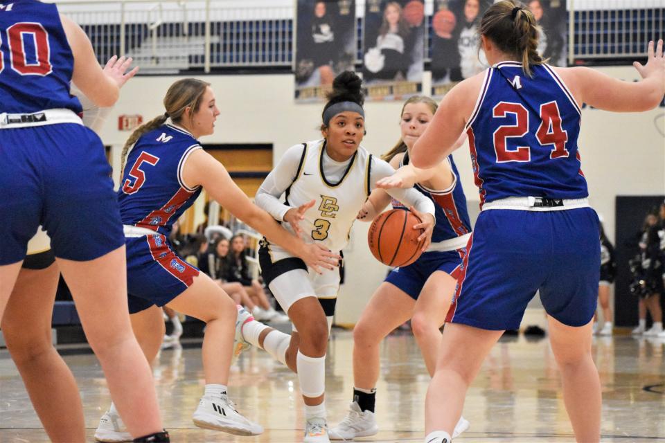 Decatur Central's Kamrah Banks (3) is met by a flurry of Martinsville defenders during the Hawks' matchup with the Artesians on Jan. 6, 2023.