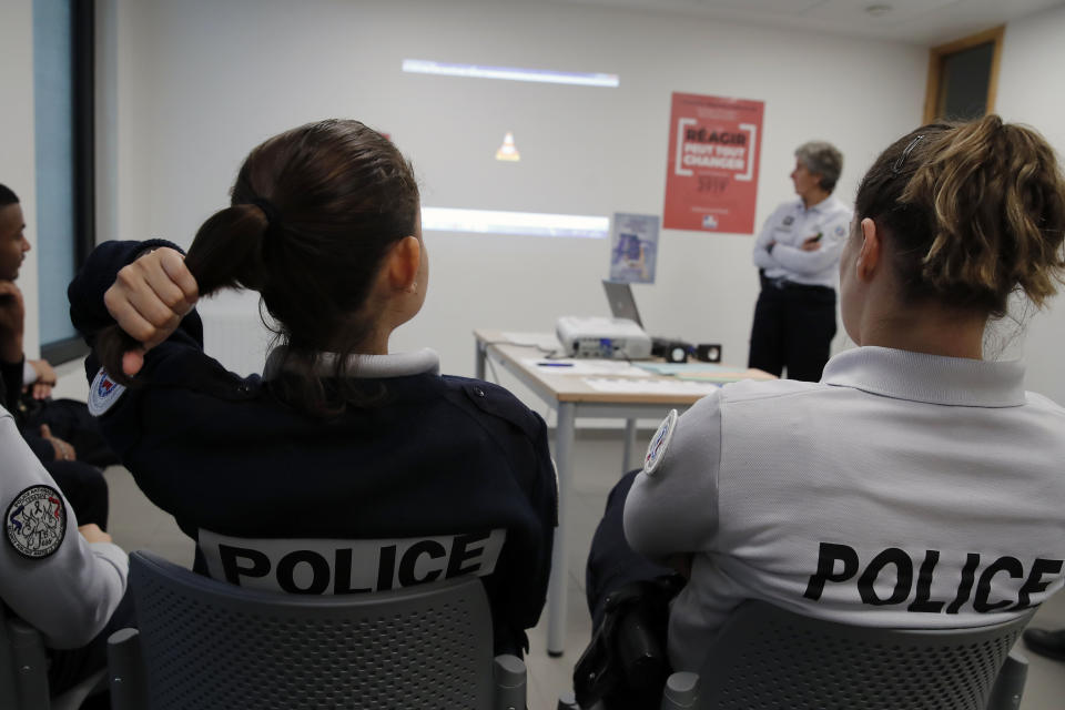 Police officers attend a training on how to respond to complaints of domestic violence, in the Paris suburb of Les Mureaux, Friday, Nov. 8, 2019. The training was the first specific training on domestic violence that the officers had received since police school, and it comes amid increased efforts by the French government and activists to address a problem French President Emmanuel Macron has called "France's shame." (AP Photo/Francois Mori)