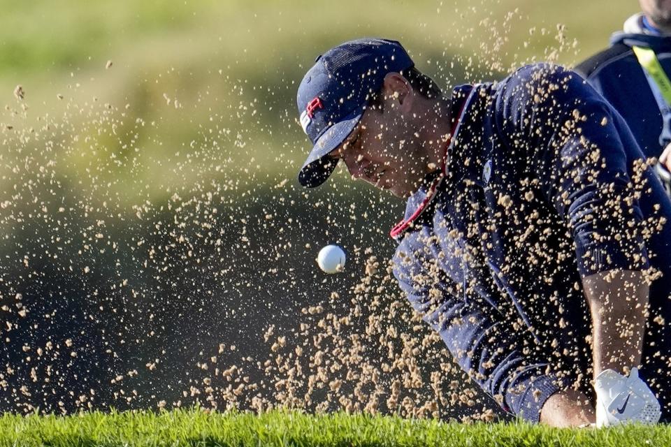 Team USA's Brooks Koepka hits from a bunker on the eighth hole during a foursomes match the Ryder Cup at the Whistling Straits Golf Course Saturday, Sept. 25, 2021, in Sheboygan, Wis. (AP Photo/Jeff Roberson)