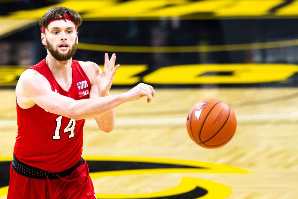 Nebraska forward Trevor Lakes (14) passes during a NCAA Big Ten Conference men's basketball game, Thursday, March 4, 2021, at Carver-Hawkeye Arena in Iowa City, Iowa.