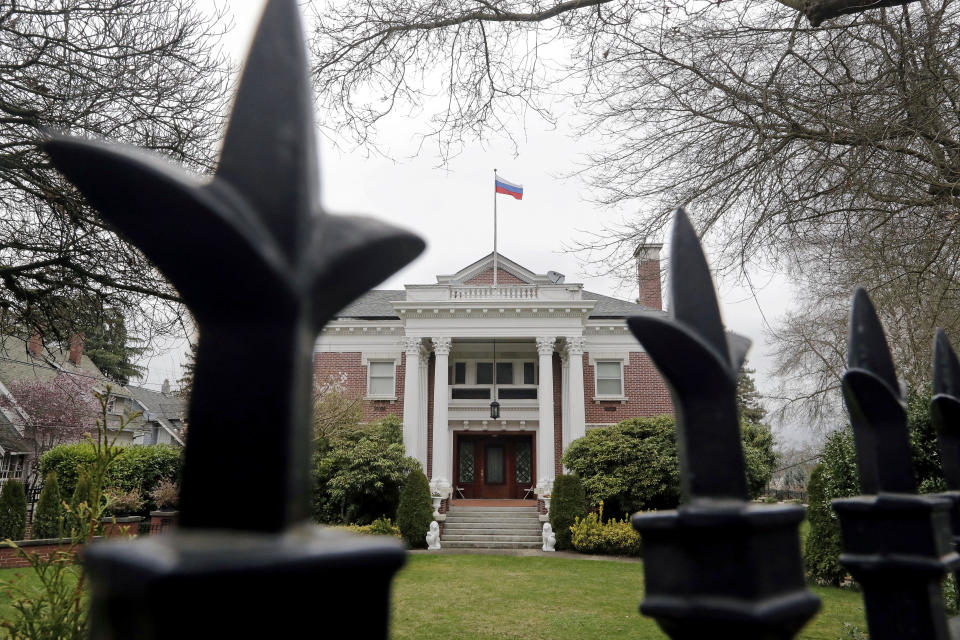 A metal fence surrounds the residence of the Russia consul-general in Seattle on March 26. (Photo: Elaine Thompson/AP)