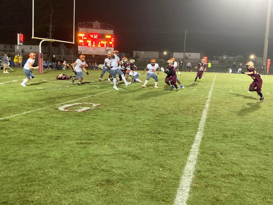 Escambia quarterback Anthony Hall (6) throws a pass under pressure against St. Augustine in an FHSAA Region 1-3S high school football playoff on November 17, 2023. [Ward Clayton/For the St. Augustine Record]