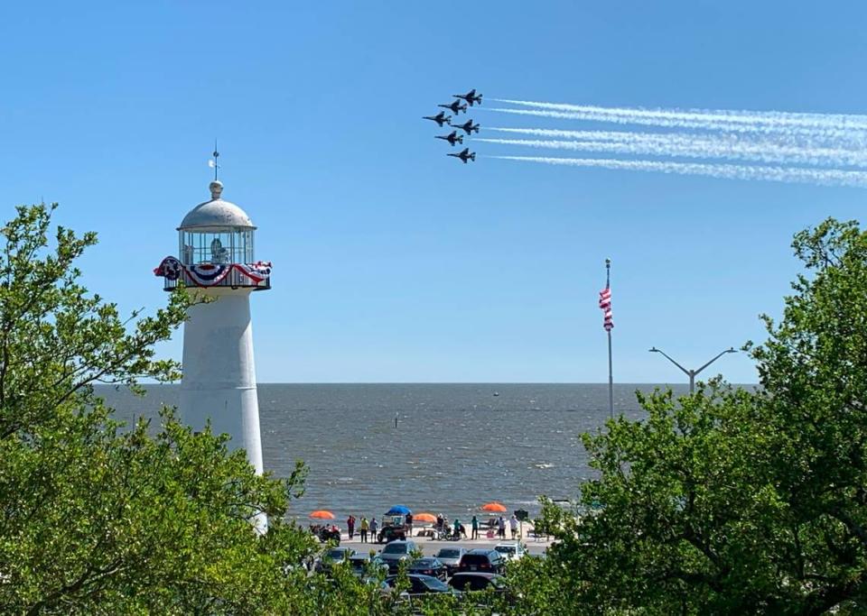 The U.S. Air Force Thunderbirds fly past the Biloxi Lighthouse during a practice for the Thunder Over the Sound airshow on Friday, April 28, 2023.