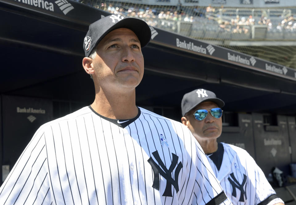 New York Yankees' Andy Pettitte is introduced at the Yankees Old Timers' Day baseball game as Reggie Jackson, right, looks on Sunday, June 17, 2018, at Yankee Stadium in New York. (AP Photo/Bill Kostroun)