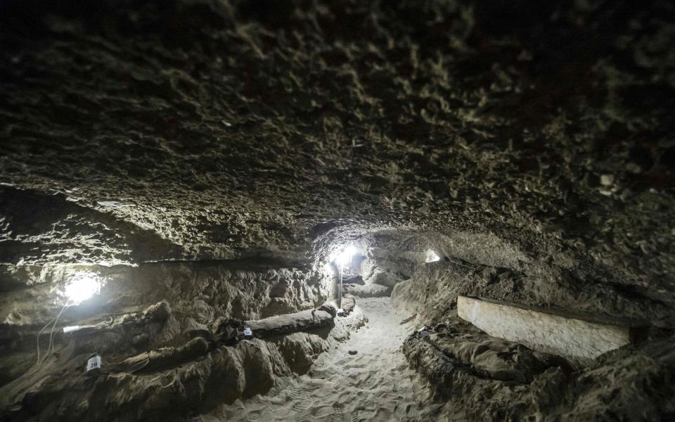 Egyptian archaeologists have discovered 17 non-royal mummies in the desert catacombs, an "unprecedented" find for the area south of Cairo - Credit: AFP