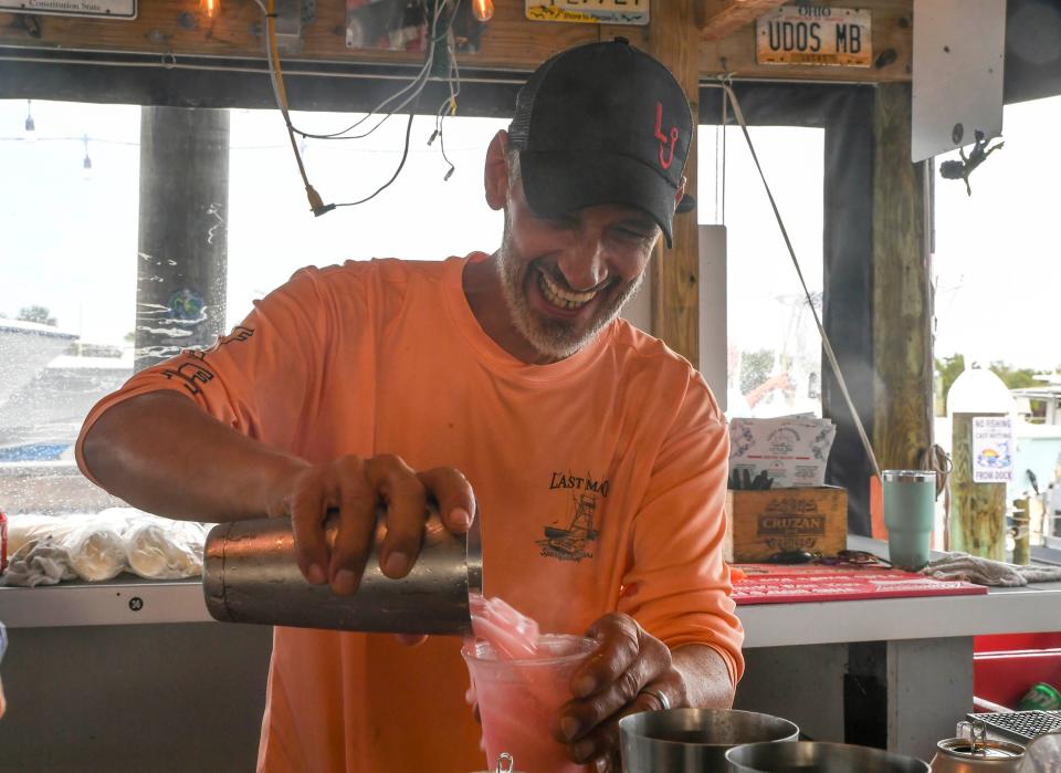 The staff and customers of the Little Jim Bait & Tackle enjoy an afternoon at the restaurant and boat docks on Tuesday, Nov. 22, 2022 in Fort Pierce. 