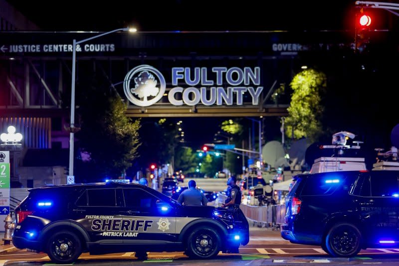 Fulton County, Ga., sheriff's deputies provide enhanced security outside the county courthouse in Atlanta after a grand jury returned an indictment against former President Donald Trump and 18 associates Monday night in Atlanta. Photo by Erik S. Lesser/EPA-EFE