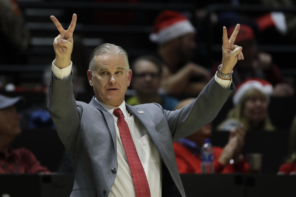 San Diego State head coach Brian Dutcher reacts during the second half of an NCAA college basketball game against San Diego Christian Wednesday, Dec. 18, 2019, in San Diego. (AP Photo/Gregory Bull)