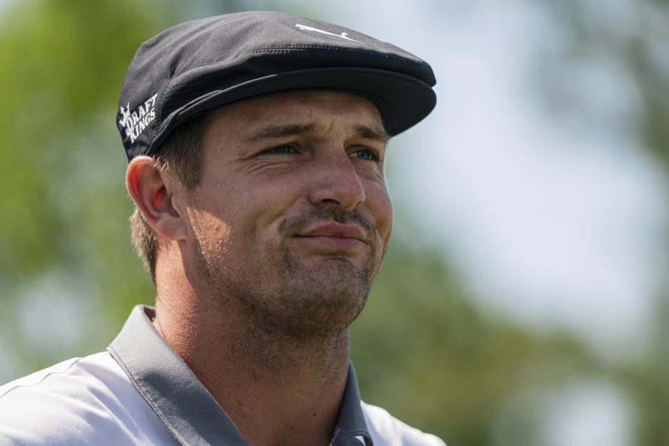 FILE - Bryson DeChambeau looks down the 15th hole during the third round of the Wells Fargo Championship golf tournament at Quail Hollow in Charlotte, N.C., in this Saturday, May 8, 2021, file photo. Brooks Koepka is back on tour, playing the inaugural Palmetto Championship for his first tournament since the PGA Championship and since his apparent fued with Bryson DeChambeau moved to a new level. (AP Photo/Jacob Kupferman, File)