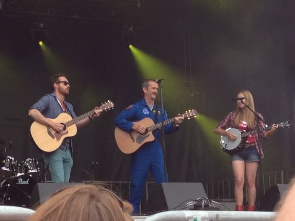 Canadian astronaut Chris Hadfield performs with the Trent Severn folk trio on Canada Day (July 1) in Ottawa.
