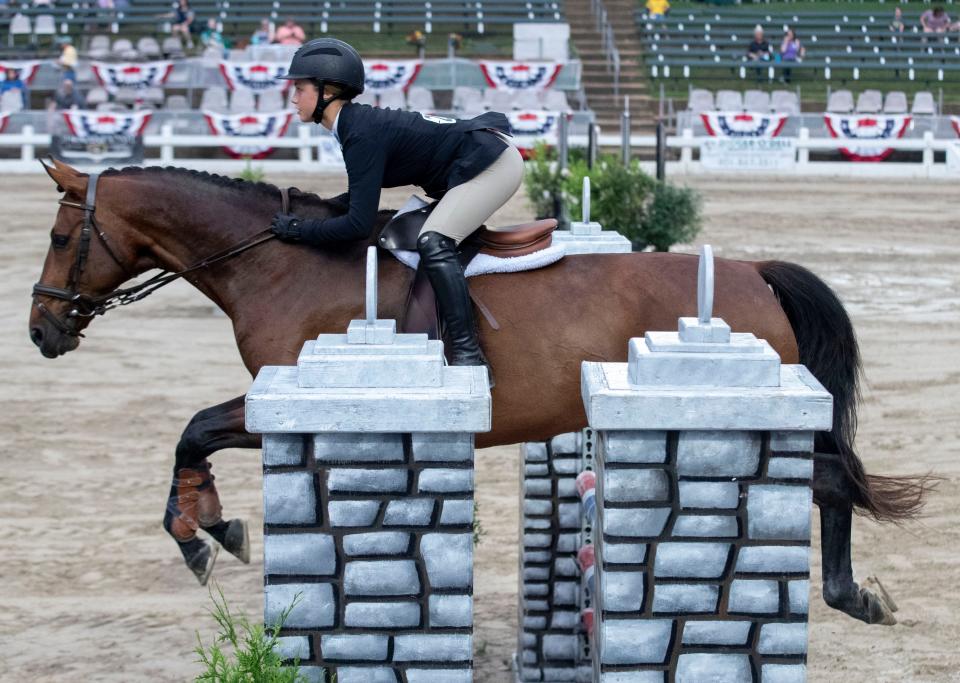 Hanna Hudson and her horse KTS Diregina compete in the hunter/jumper versatility challenge during the first day of the Germantown Charity Horse Show on Tuesday, June 7, 2022, at the show grounds, 7745 Old Poplar Pike. The show continues through June 11. 