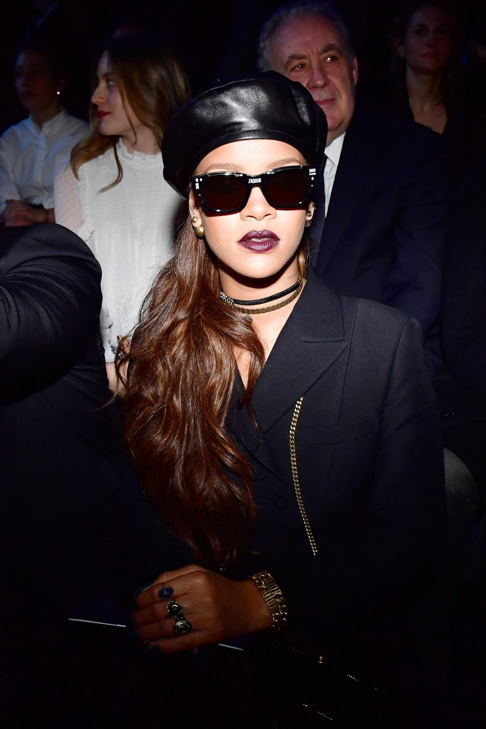 Rihanna wears the new Dior black leather beret during the fashion brand’s show in Paris.