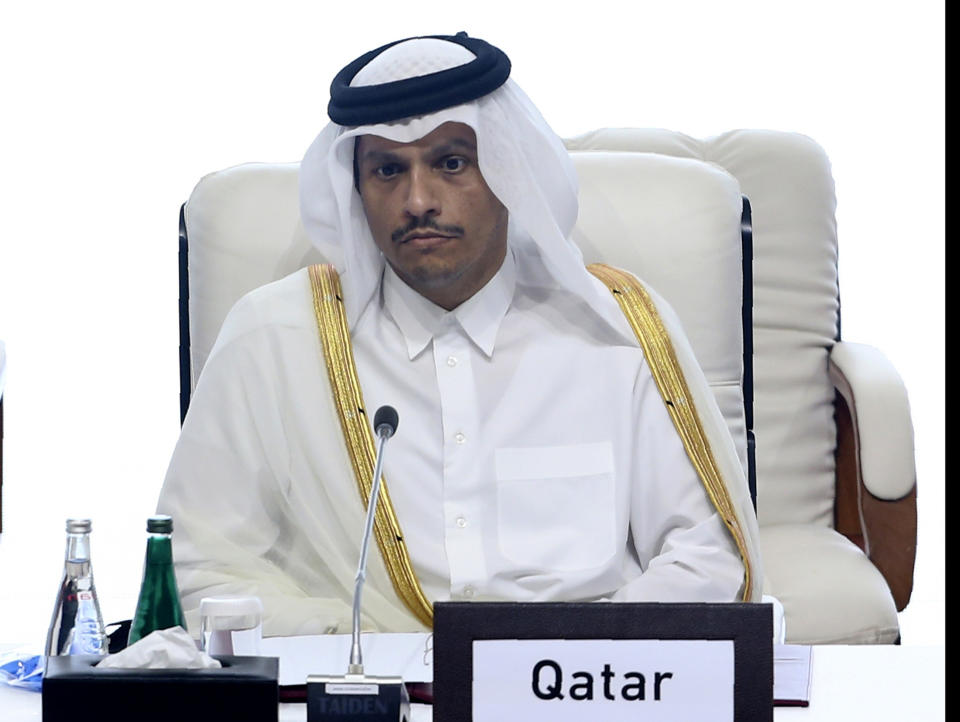 Qatar's Minister of Foreign Affairs Sheikh Mohamad Bin Abdel Rahman Al-Thani talks to the audience at the opening session of the peace talks between the Afghan government and the Taliban in Doha, Qatar, Saturday, Sept. 12, 2020. (AP Photo/Hussein Sayed)