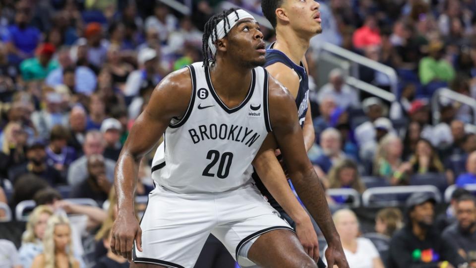 Mar 26, 2023; Orlando, Florida, USA; Brooklyn Nets center Day'Ron Sharpe (20) and Orlando Magic guard Caleb Houstan (2) watch for the rebound during the second half at Amway Center. Mandatory Credit: Mike Watters-USA TODAY Sports