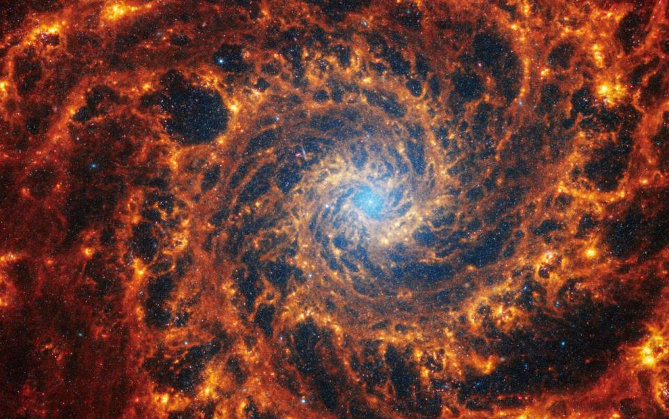 The spiral arm NGC 628 is 32 million light-years away in the constellation Pisces, a flash of gas and dust.