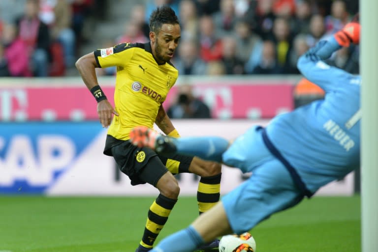 Dortmund's striker Pierre-Emerick Aubameyang (L) scores against Bayern Munich on October 4, 2015