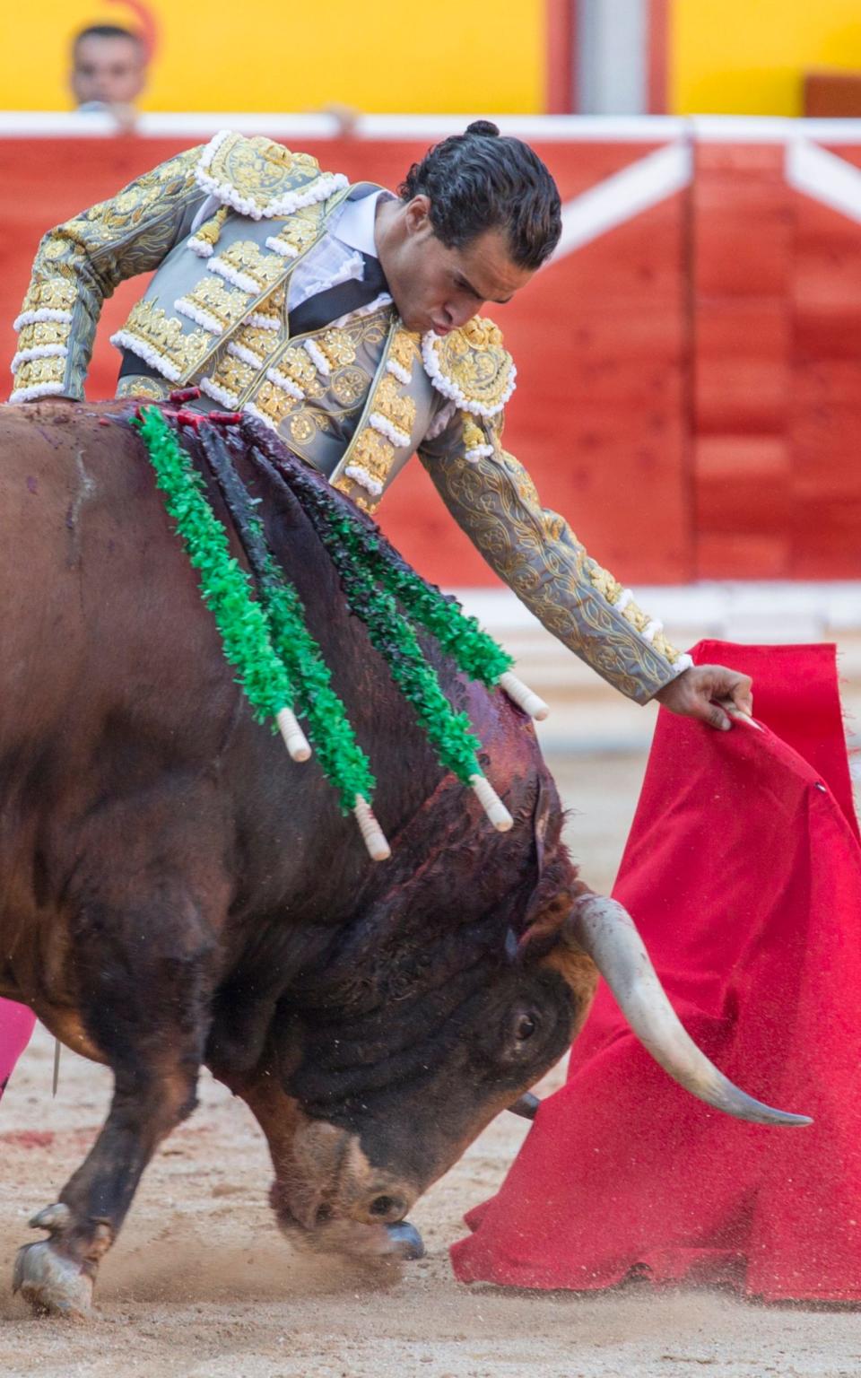 Spanish bullfighter Ivan Fandino as he fights a bull in a bullfight in the Fiesta de San FermÃ­n in Pamplona - Credit: Jim Hollander