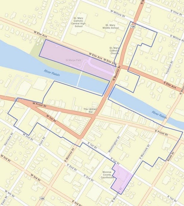 A map of downtown Monroe showing the borders of the social district in blue is pictured. Areas shaded purple at St. Mary's Park and Government Plaza will only be part of the district during special events.