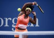 Serena Williams of the U.S. hits a return to Kiki Bertens of the Netherlands during their match at the U.S. Open Championships tennis tournament in New York, September 2, 2015. REUTERS/Mike Segar