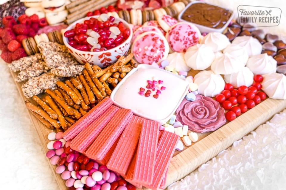 <p>Favorite Family Recipes</p><p>The language of love comes alive and is beautifully presented with a pink and red Valentine-themed candy and cookie dessert charcuterie board. Enjoy with a sweetheart or your kids or friends!</p><p><strong>Get the recipe: <a href="https://www.favfamilyrecipes.com/dessert-charcuterie-board/" rel="nofollow noopener" target="_blank" data-ylk="slk:Valentine Charcuterie Board;elm:context_link;itc:0;sec:content-canvas" class="link ">Valentine Charcuterie Board</a></strong></p><p><strong>Related: <a href="https://www.yahoo.com/lifestyle/feel-love-valentines-day-25-184211303.html" data-ylk="slk:25 Cute and Romantic Valentine's Day Desserts;elm:context_link;itc:0;sec:content-canvas;outcm:mb_qualified_link;_E:mb_qualified_link;ct:story;" class="link  yahoo-link">25 Cute and Romantic Valentine's Day Desserts</a></strong></p>