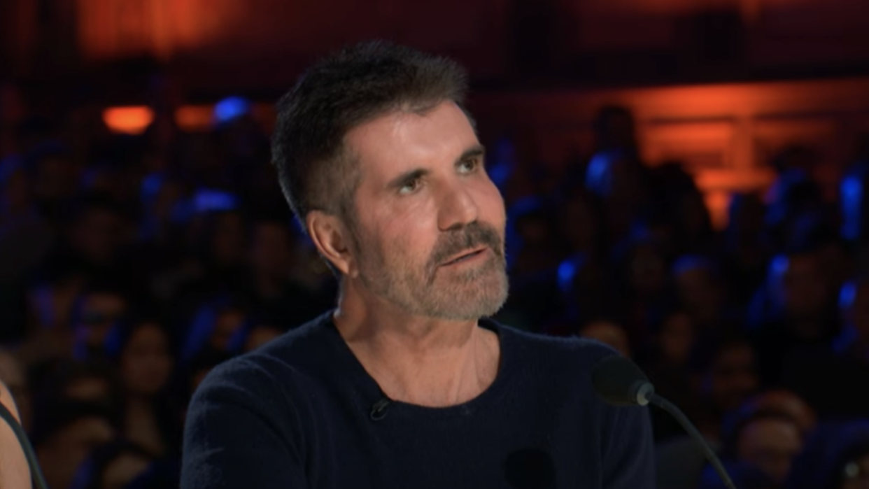  Simon Cowell looking at Putri Ariani singing on America's Got Talent Season 18 