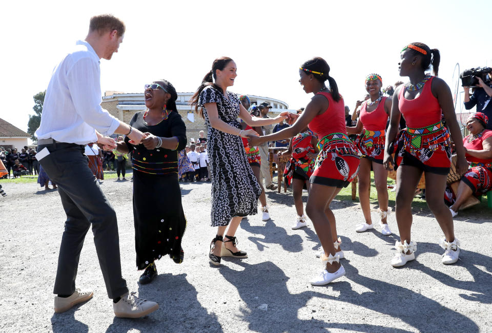 The Sussexes dance as they visit a Justice Desk initiative in Nyanga township.&nbsp; (Photo: Chris Jackson via Getty Images)