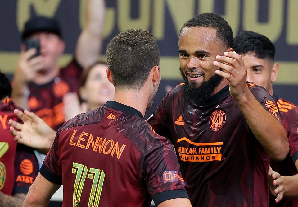 ATLANTA, GEORGIA - JUNE 20:  Anton Walkes #4 of Atlanta United reacts after scoring on a header against the Philadelphia Union with Brooks Lennon #11 during the second half at Mercedes-Benz Stadium on June 20, 2021 in Atlanta, Georgia. (Photo by Kevin C. Cox/Getty Images)