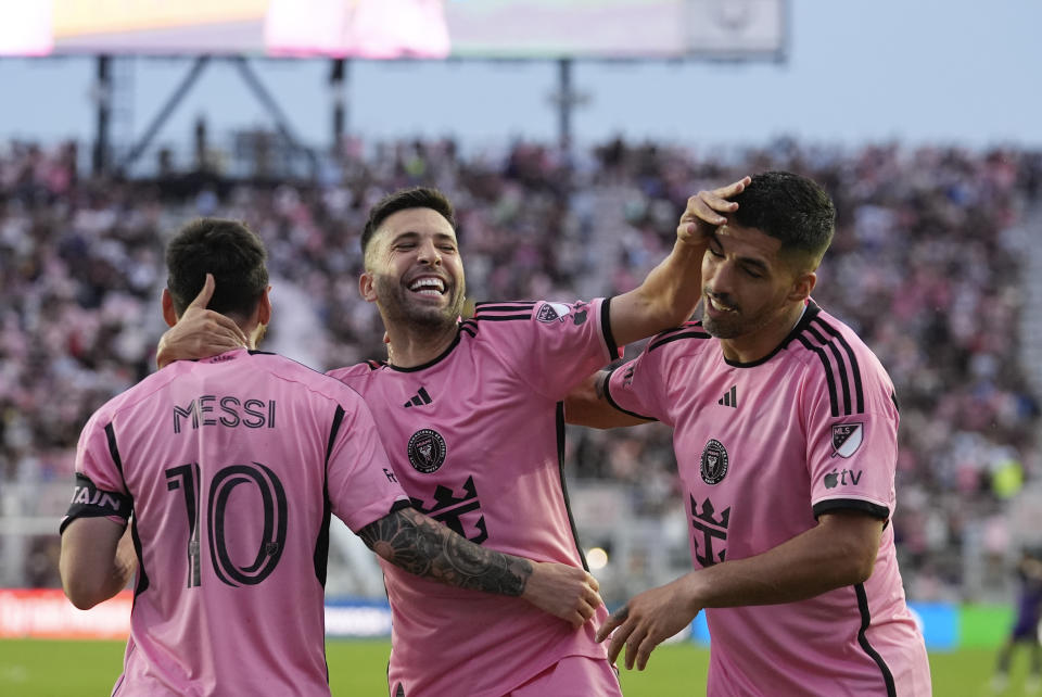 Inter Miami defender Jordi Alba, center, celebrates with teammates forward Luis Suarez, right, and forward Lionel Messi (10), after Messi scored a goal during the second half of an MLS soccer match against Orlando City, Saturday, March 2, 2024, in Fort Lauderdale, Fla. (AP Photo/Rebecca Blackwell)
