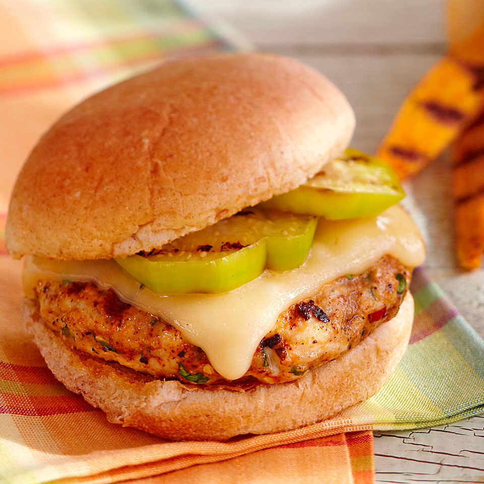 <p>Beautiful green slices of tomatillo and melted Muenster cheese sit atop these grilled turkey burgers. A teaspoon of chopped chipotle peppers is added to the ground turkey mixture, providing just a touch of heat to these mouthwatering burgers.</p>