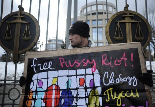 A supporter of a female Russian punk band Pussy Riot holds a poster as he pickets outside a Moscow courthouse, on March 14. The balaclava and miniskirt-clad members of the protest group burst into the Christ the Saviour Cathedral in February and belted out bits of a song denouncing the Church's open support for president-elect Vladimir Putin