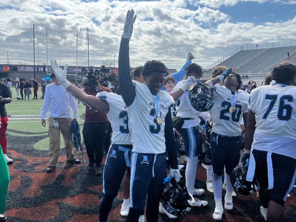 Berkeley Prep junior athlete Dallas Golden celebrates the Buccaneers upset of nationally ranked Norland on Saturday at Bragg Memorial Stadium.