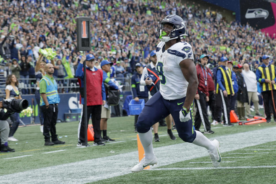 Seattle Seahawks running back Kenneth Walker III celebrates after scoring during the second half of an NFL football game against the Carolina Panthers Sunday, Sept. 24, 2023, in Seattle. (AP Photo/John Froschauer)