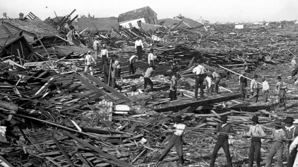 PHOTO: Men use ropes to pull away the debris of houses in order to look for bodies, after the Galveston Hurricane of 1900. (Library Of Congress/Corbis/VCG via Getty Images, FILE)