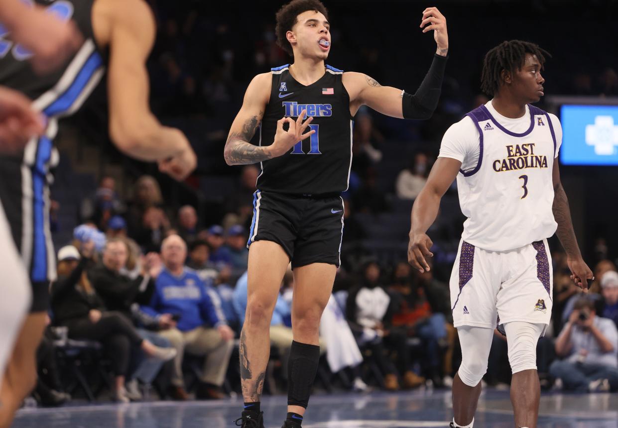 Memphis Tigers guard Lester Quinones plays the air guitar in celebration of his 3-pointer against the East Carolina Pirates at FedExForum on Thursday, Jan. 27, 2022. 