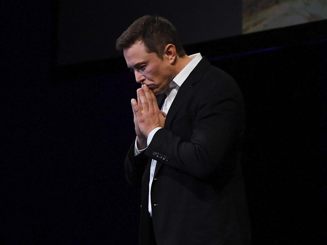 elon musk hands praying pausing pensive gesture gesturing serious spacex mark brake GettyImages 855370098