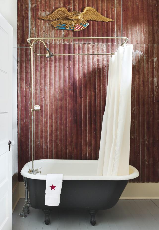 Bathroom Interior with Candles and a ClawFooted Tub · Creative Fabrica