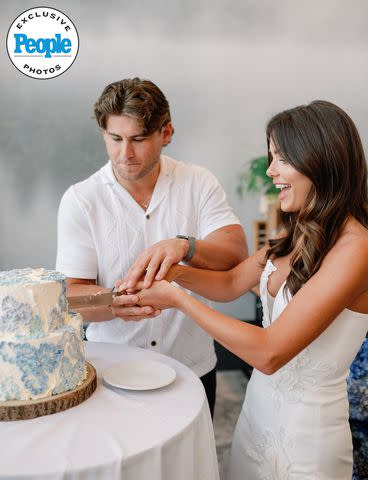 <p>Elemis/Maria Gloer</p> Hannah Ann Sluss and Jake Funk cutting cake.