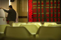 A Chinese investor uses a computer terminal to monitor stock prices at a brokerage house in Beijing Friday, Sept. 28, 2018. Asian markets rebounded on Friday as strong U.S. economic data supported the Federal Reserve's decision to raise interest rates. (AP Photo/Mark Schiefelbein)