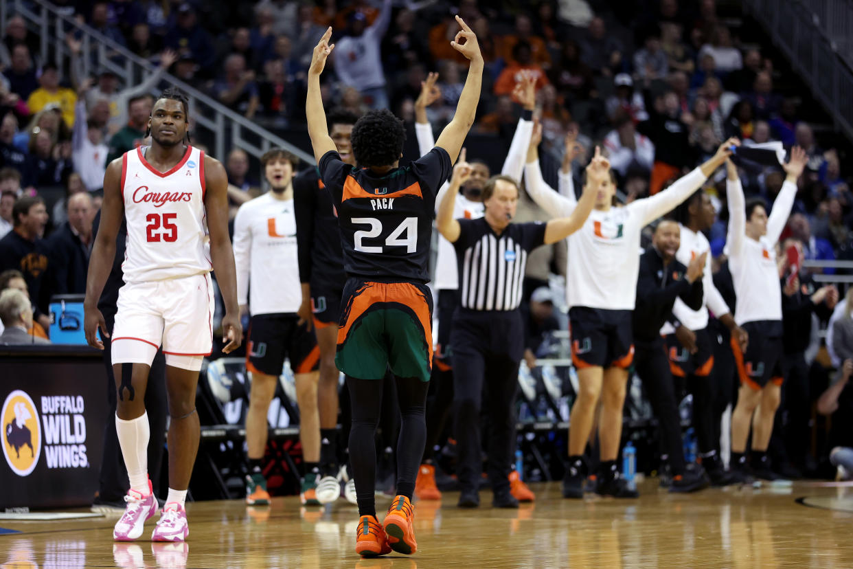 KANSAS CITY, MISSOURI - MARCH 24: Nijel Pack #24 of the Miami Hurricanes celebrates a three-point basket against Jarace Walker #25 of the Houston Cougars during the second half in the Sweet 16 round of the NCAA Men's Basketball Tournament at T-Mobile Center on March 24, 2023 in Kansas City, Missouri. (Photo by Gregory Shamus/Getty Images)