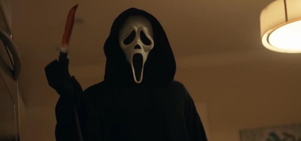 Ghostface holding a bloody knife in "Scream" (2022)