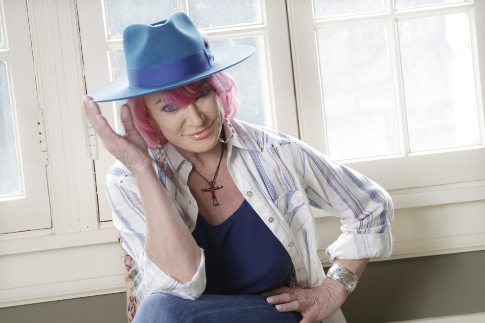 In this Aug. 20, 2019, photo, Tanya Tucker sits for a portrait session in Nashville, Tenn., to promote her new album, “While I’m Livin’, ” out on Friday, (AP Photo/Mark Humphrey)