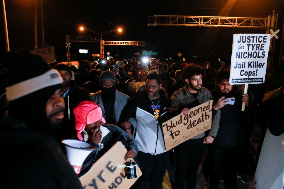 Demonstrators march on the Memphis-Arkansas Bridge as they protest the killing of Tyre Nichols on Friday, Jan. 27, 2023, in Memphis, Tenn. 