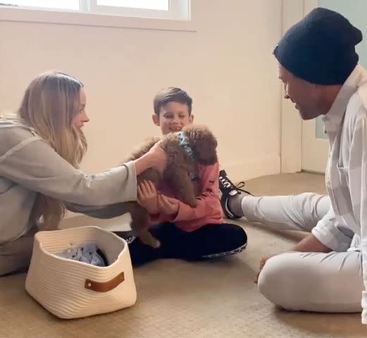 Peta Murgatroyd/Instagram Maks Chmerkovskiy, Peta Murgatroyd's and their son Shai holding a dog