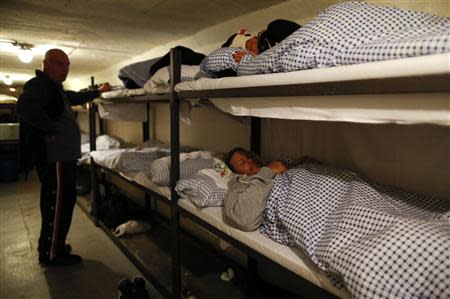 Participants of the 'reality event' one night sleep in a room of the 'Bunker-Museum' in Rennsteighoehe near the eastern city of Ilmenau October 12, 2013. REUTERS/Ina Fassbender